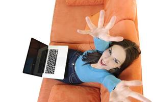 woman using a laptop computer at home photo