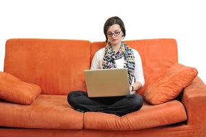 woman using a laptop computer at home photo