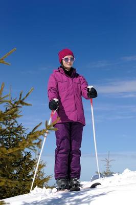 AI generated young man skiing on high snow mountain in winter