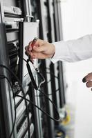 young it engeneer in datacenter server room photo