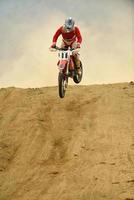 Riding a motocross bike photo