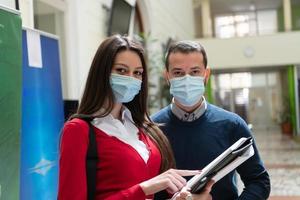 Portrait of multiethnic students group at university wearing protective face mask photo