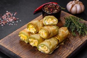 Low carbs Zucchini pockets filled with savory spinach, eggs and cheese photo