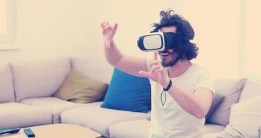 man using VR-headset glasses of virtual reality photo