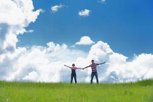 Portrait of romantic young couple smiling together outdoor photo