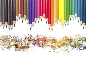 Color pencils with color pencil shavings on white background photo