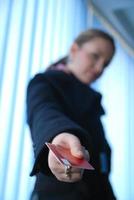 .businesswoman holding credit card photo