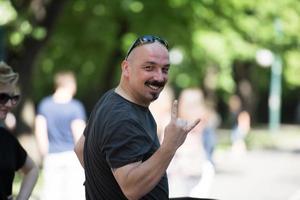 man showing a rock hand gesture photo