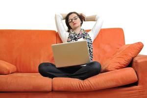 woman using a laptop computer at home photo