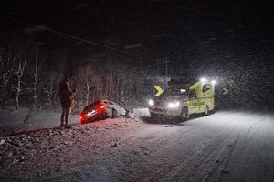 car accident on slippery winter road at night photo