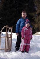 Brother and sister portrait in winter time photo