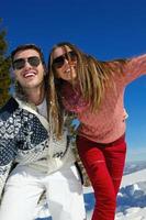 young couple on winter vacation photo