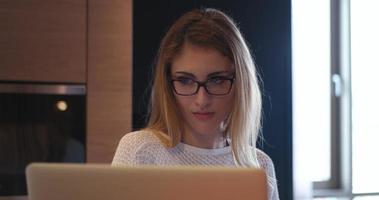 woman freelancing from home and drinking caffee photo