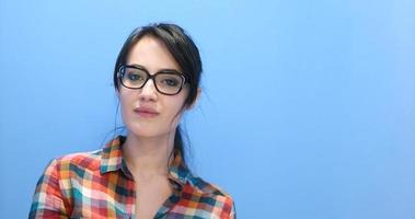 woman smiling wearing on a pair of large glasses photo