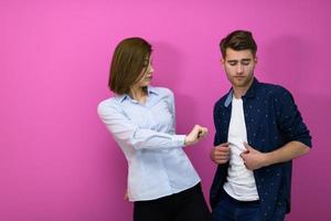 couple dancing in front of a pink background photo