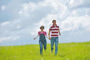 Portrait of romantic young couple smiling together outdoor photo