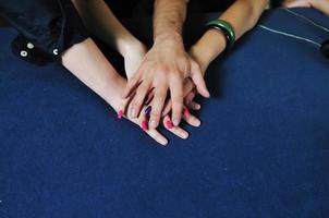 Hands on blue surface photo