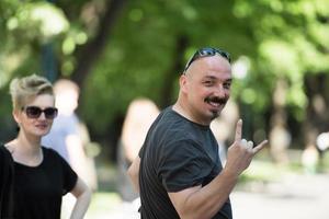 man showing a rock hand gesture photo