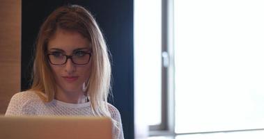 woman freelancing from home and drinking caffee photo