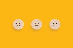 Wooden blocks with the happy face smile face symbol on yellow background, evaluation, Increase rating, Customer experience, satisfaction and best excellent services rating concept. Vector illustrator