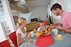 family have healthy breakfast at home photo