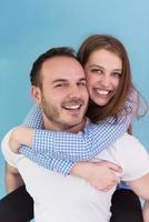 young man piggybacking his girlfriend photo