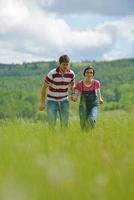 Portrait of romantic young couple smiling together outdoor photo