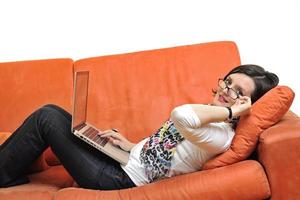 woman using a laptop computer at home photo