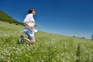 Young happy woman in green field photo