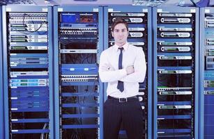 young it engeneer in datacenter server room photo