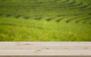 Empty wooden table with view of mountain or wooden desk with plantation nature with bokeh background, copy space for your text photo