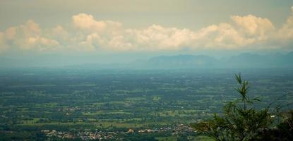 The beautiful natural landscape of a small urban community and fog in the rainy season of Thailand. photo