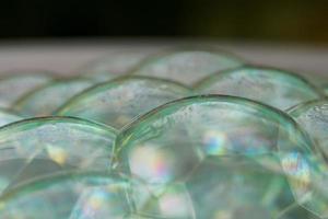 White bath bubbles, white and clear bubbles. photo