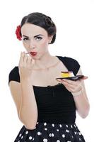 beautiful young woman eat sweet cake photo