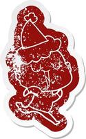 happy cartoon distressed sticker of a bald man wearing santa hat vector