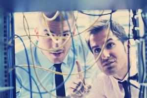 it engineers in network server room photo