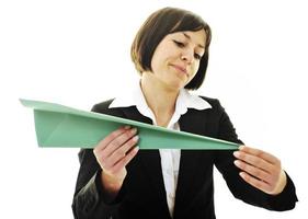 business woman throwing  paper airplane photo