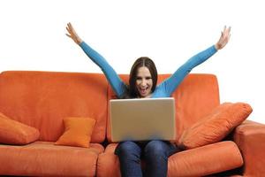 woman using a laptop computer at home photo