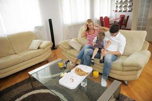 family eating pizza photo