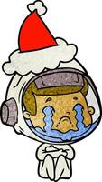 textured cartoon of a crying astronaut wearing santa hat vector