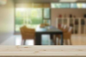 Empty wooden table top with view of office or wooden desk with library room with blur background, copy space for your text photo