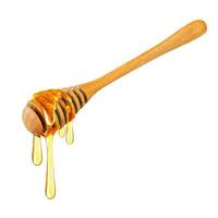 Honey dripping isolated on a white background, Dripped honey, Honey dipper photo