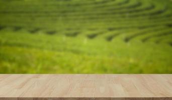 Empty wooden table with view of mountain or wooden desk with plantation nature with bokeh background, copy space for your text photo