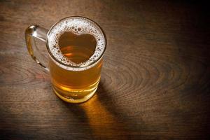 Glass of Light Beer with wheat on the bar counter, copy space for your text photo