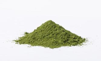 Heap of matcha green tea powder isolated on white background, Organic product from the nature for healthy with traditional style photo