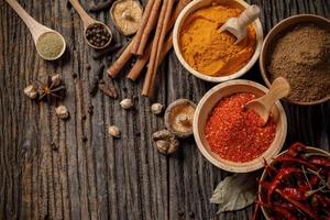 Herbs and spices on the wooden table photo