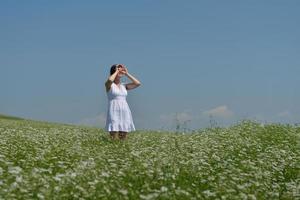 Young happy woman in green field photo