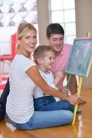 family drawing on school board at home photo