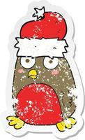 retro distressed sticker of a cartoon christmas robin vector