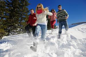 friends have fun at winter on fresh snow photo